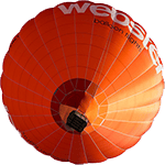 An orange hot air balloon as seen from below